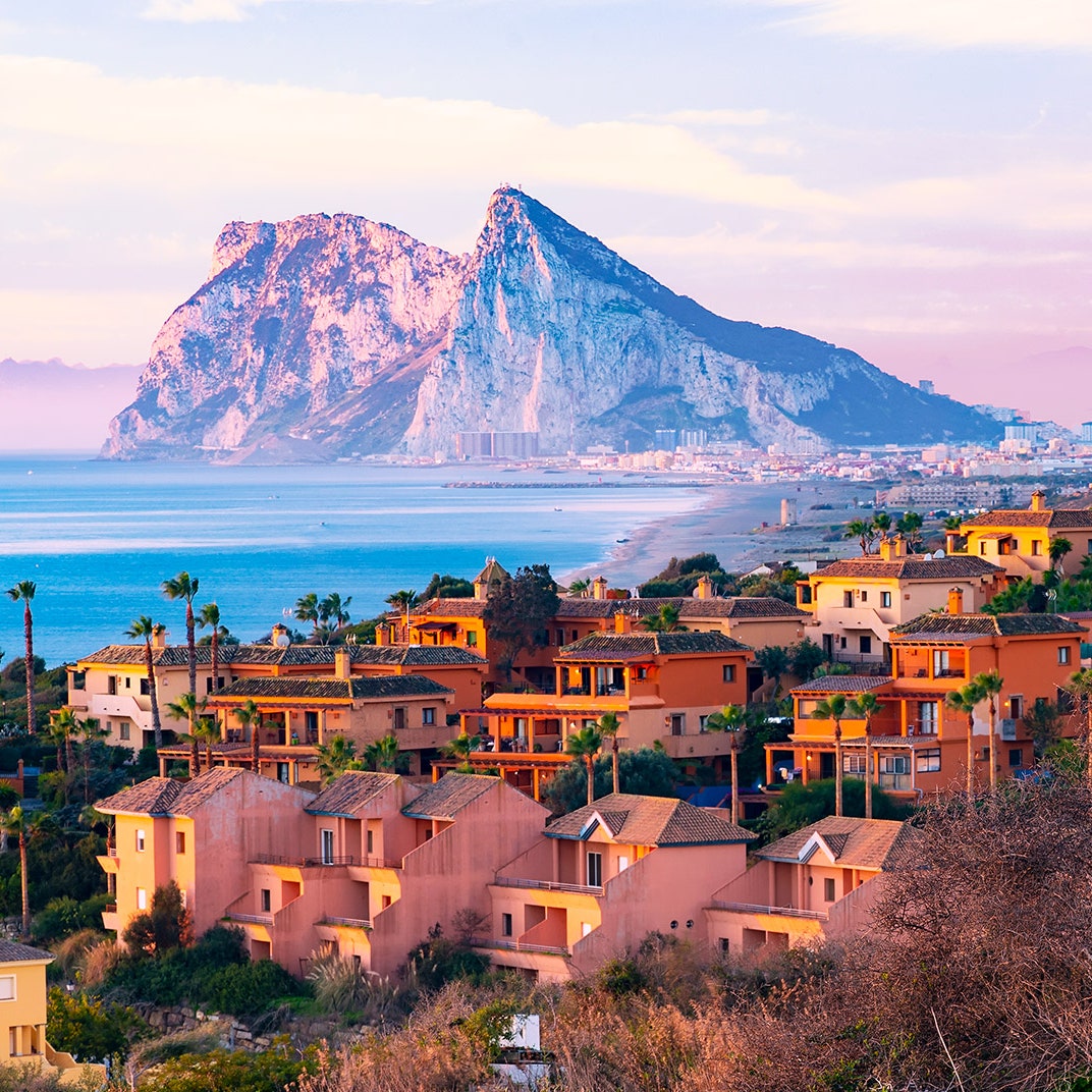 Houses on a hill overlooking "The Rock" of Gibraltar