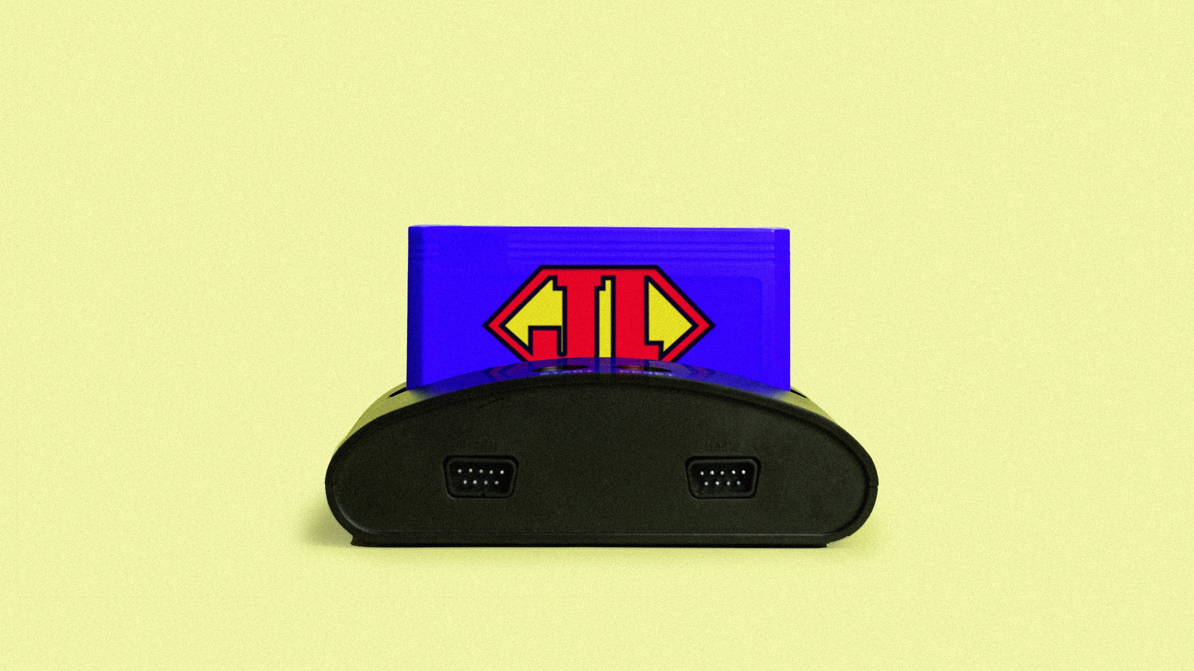 Old retro video game console with cartridge and a JL in a superman style.