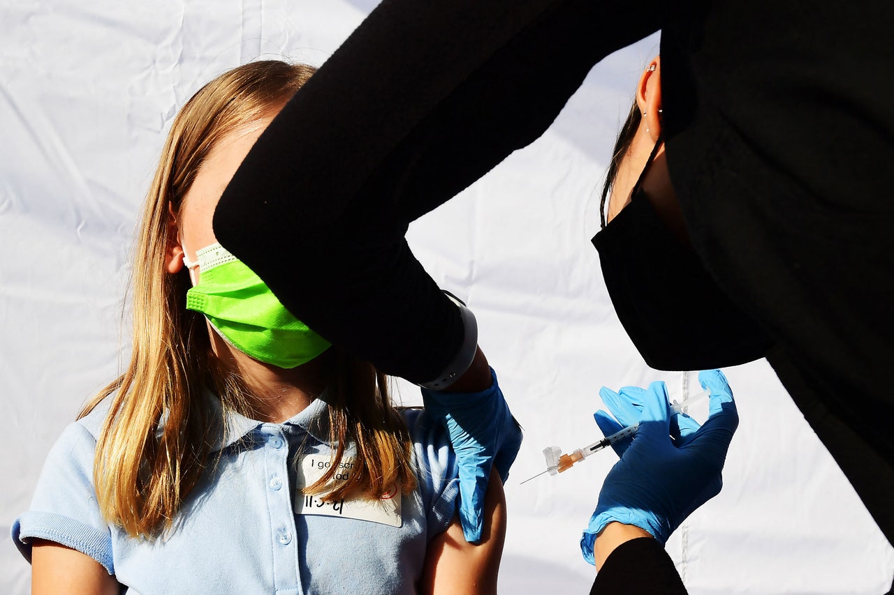 kid getting vaccine